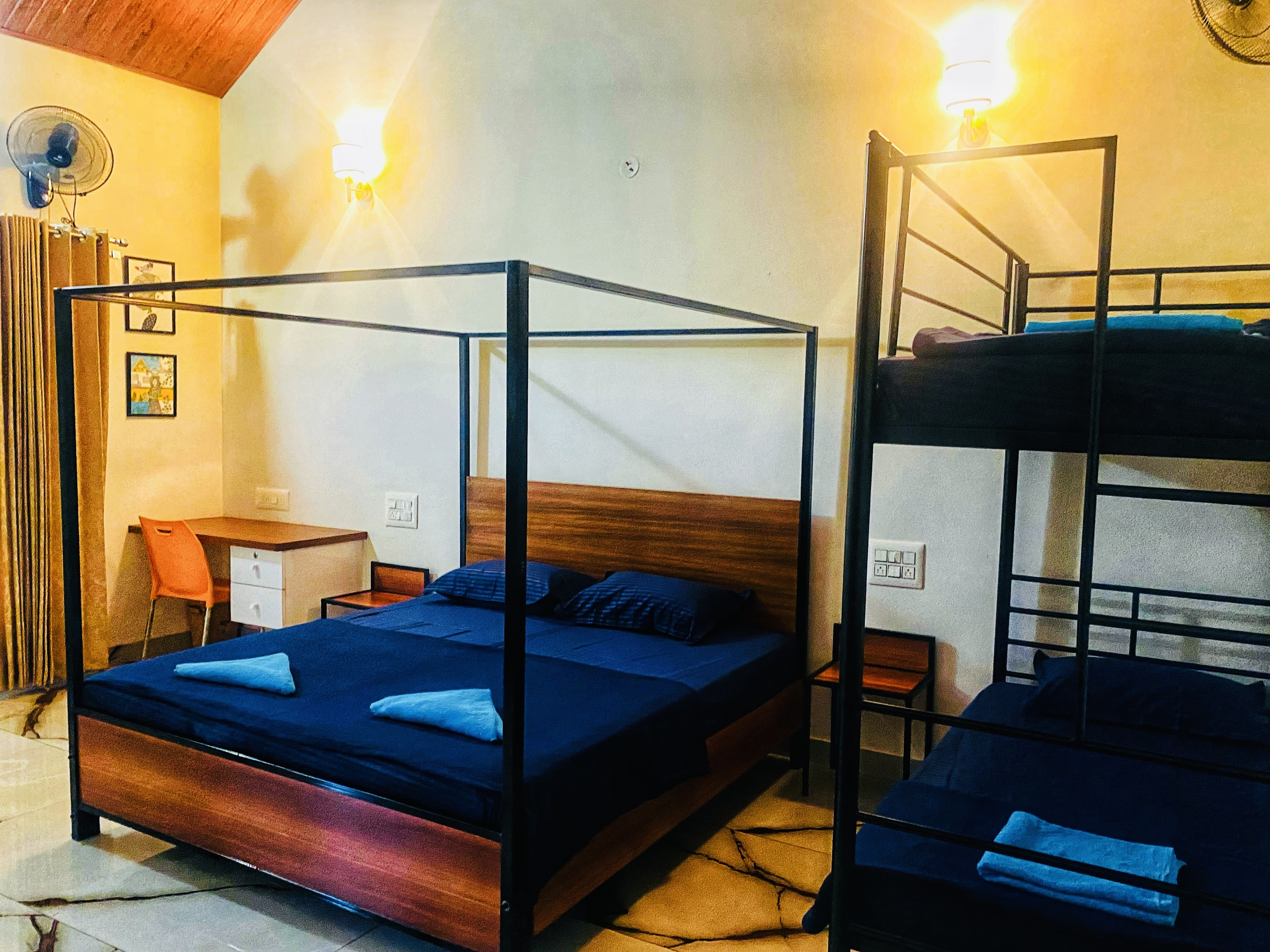 Bedroom with four-poster king bed and matching bunk beds
