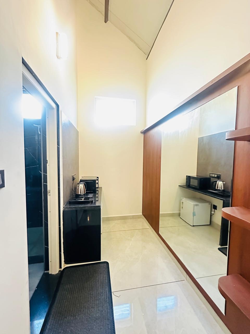 In-room kitchenette with oven, kettle and mini fridge